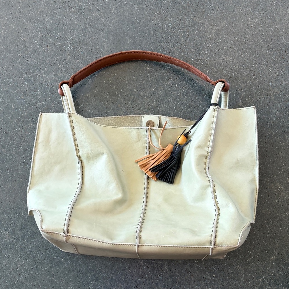 The Sak Cream Leather Shoulder Bag with Brown Handle and Tassels